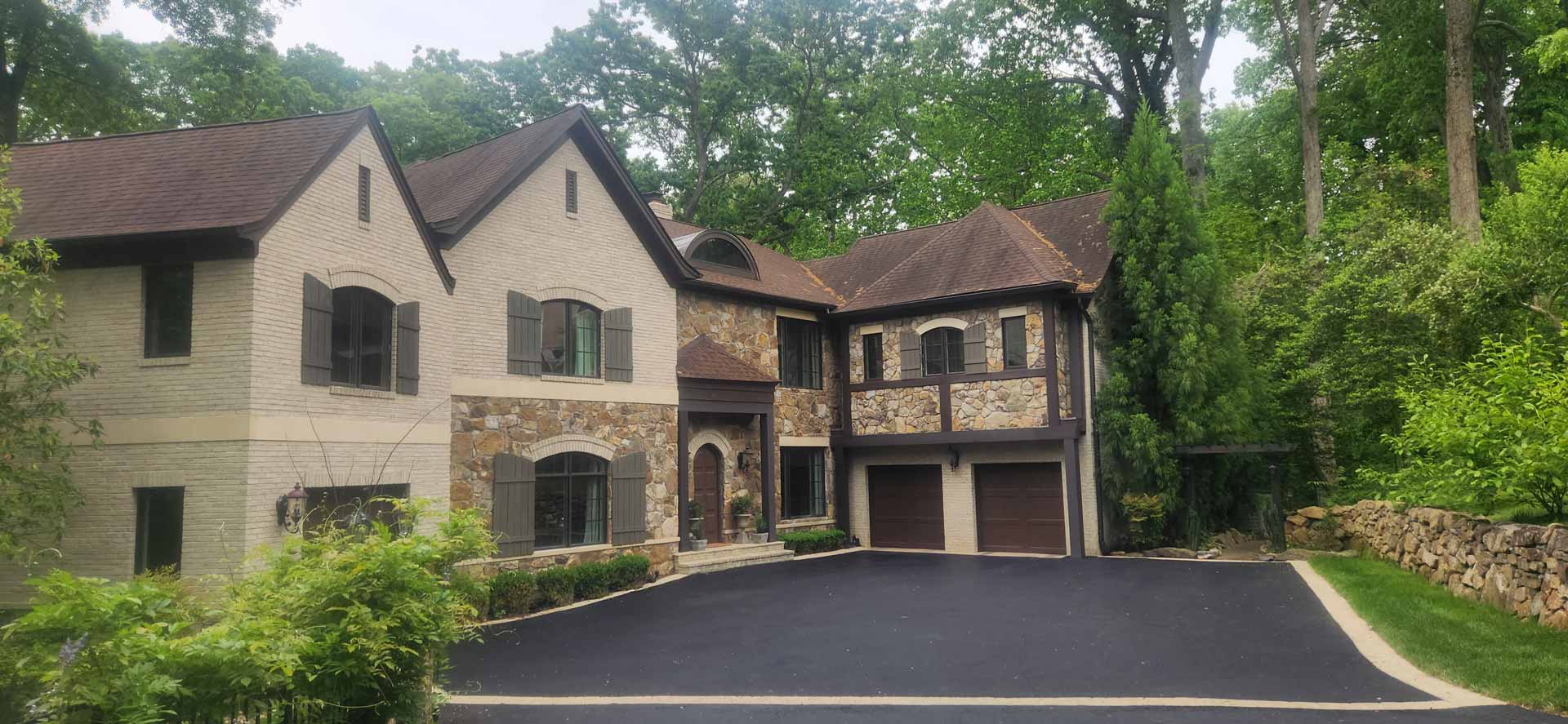 Newly paved driveway by HOTMIXX LLC