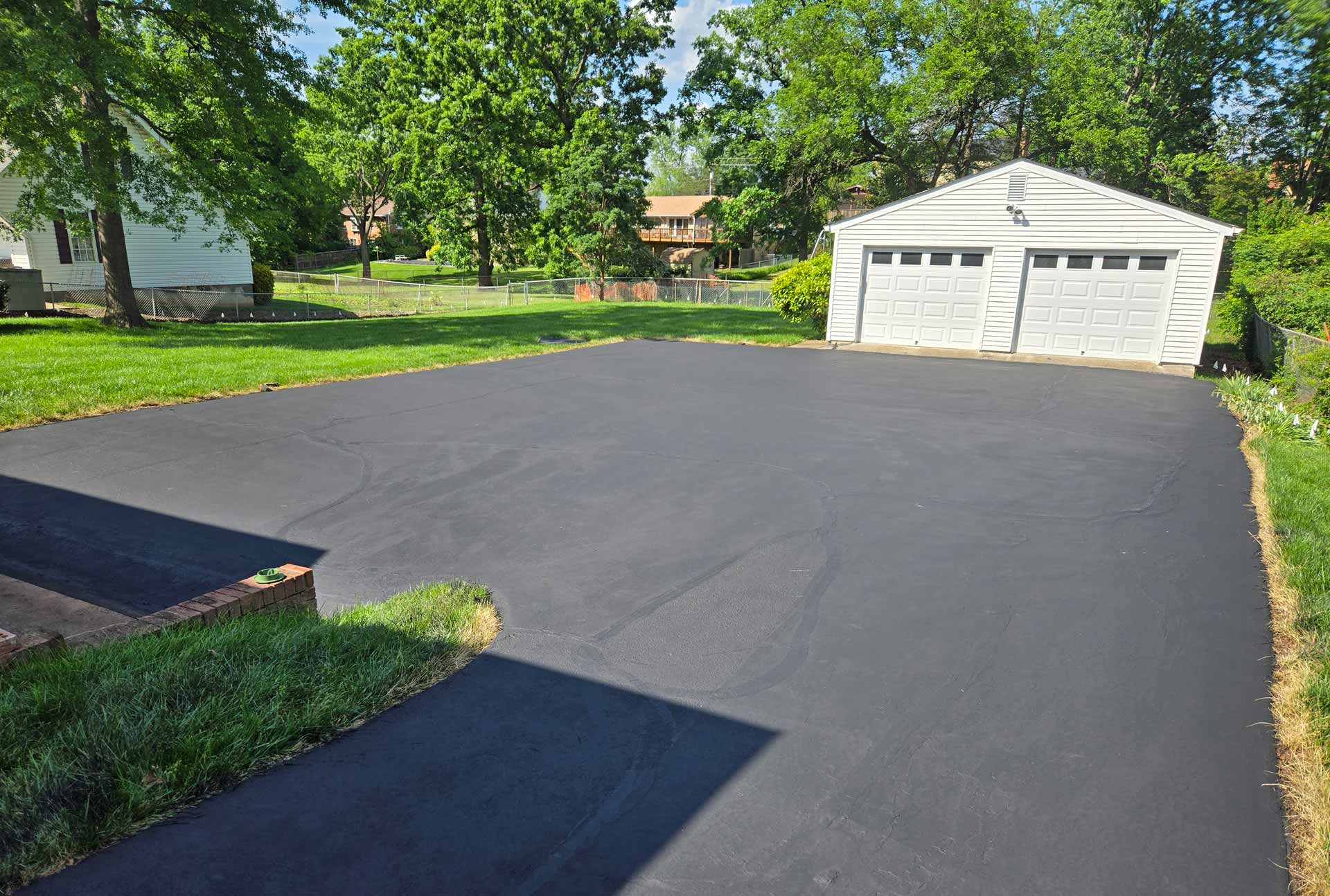 Newly repaired and sealed driveway by HOTMIXX LLC