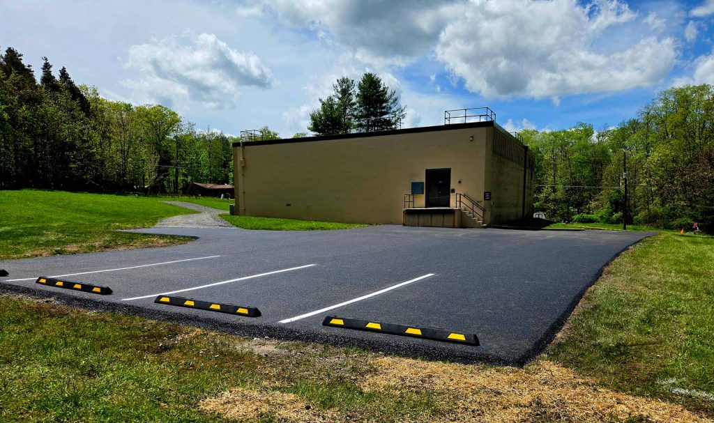 Newly paved and striped parking lot by HOTMIXX LLC
