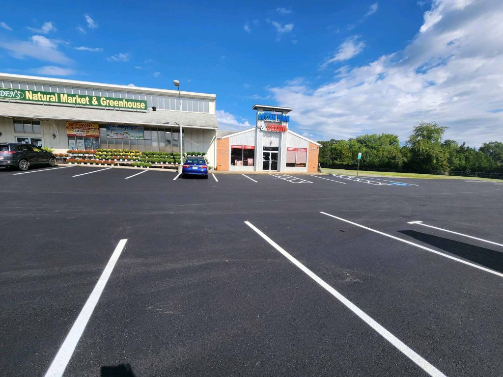 Newly paved and striped parking lot by HOTMIXX LLC